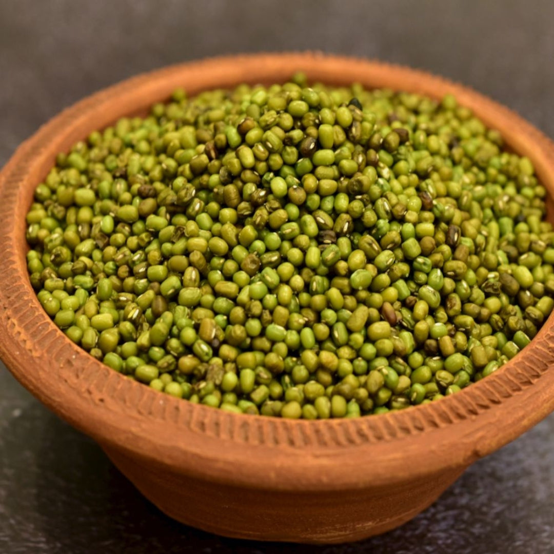 Bowl of organic moong whole lentils showcasing fresh, green mung beans for healthy cooking