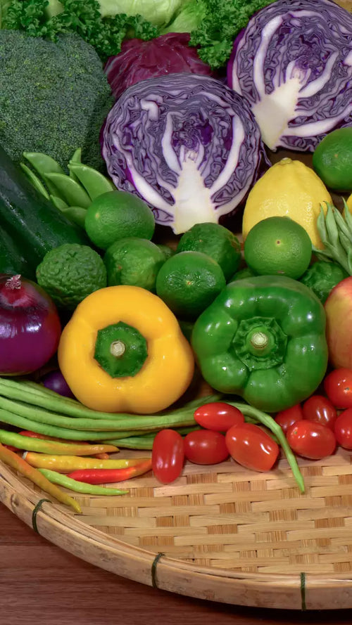 Colorful assortment of exotic organic vegetables Mumbai including purple cabbage, bell peppers, and herbs