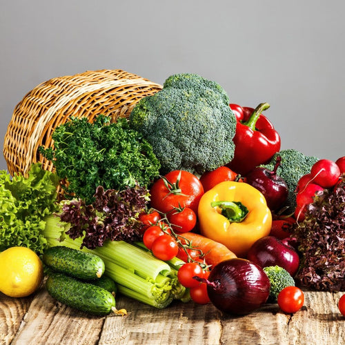 Fresh organic vegetables Mumbai including broccoli, peppers, tomatoes, and leafy greens arranged artistically