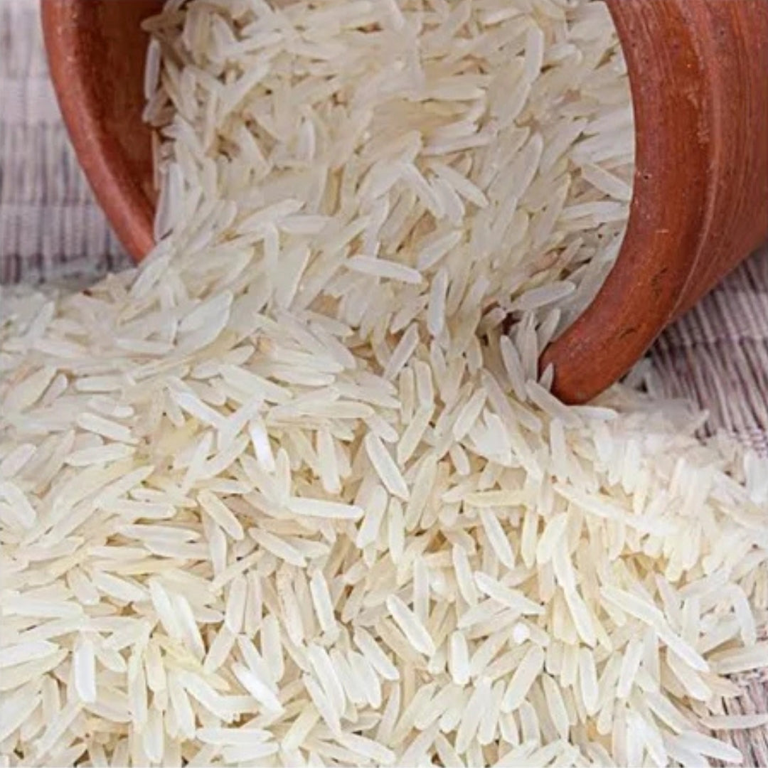 Organic basmati rice spilling from a clay pot on a woven mat for a natural cooking experience