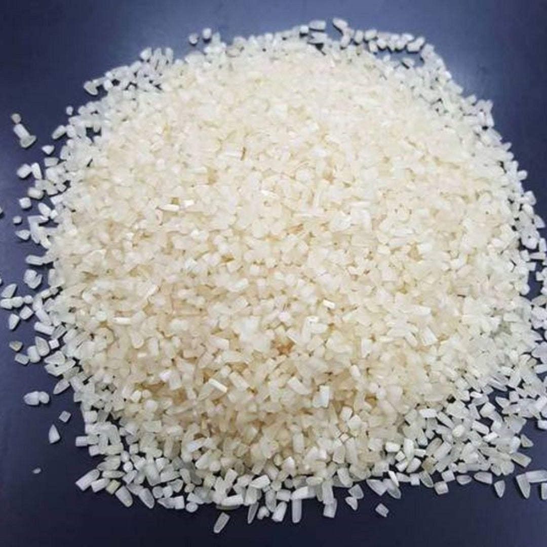 Organic basmati tukada rice piled on a black background, perfect for various culinary dishes