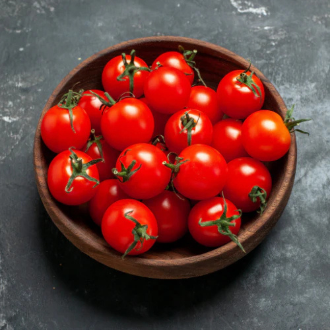 Fresh organic cherry tomatoes Mumbai in a wooden bowl, perfect for healthy salads and cooking