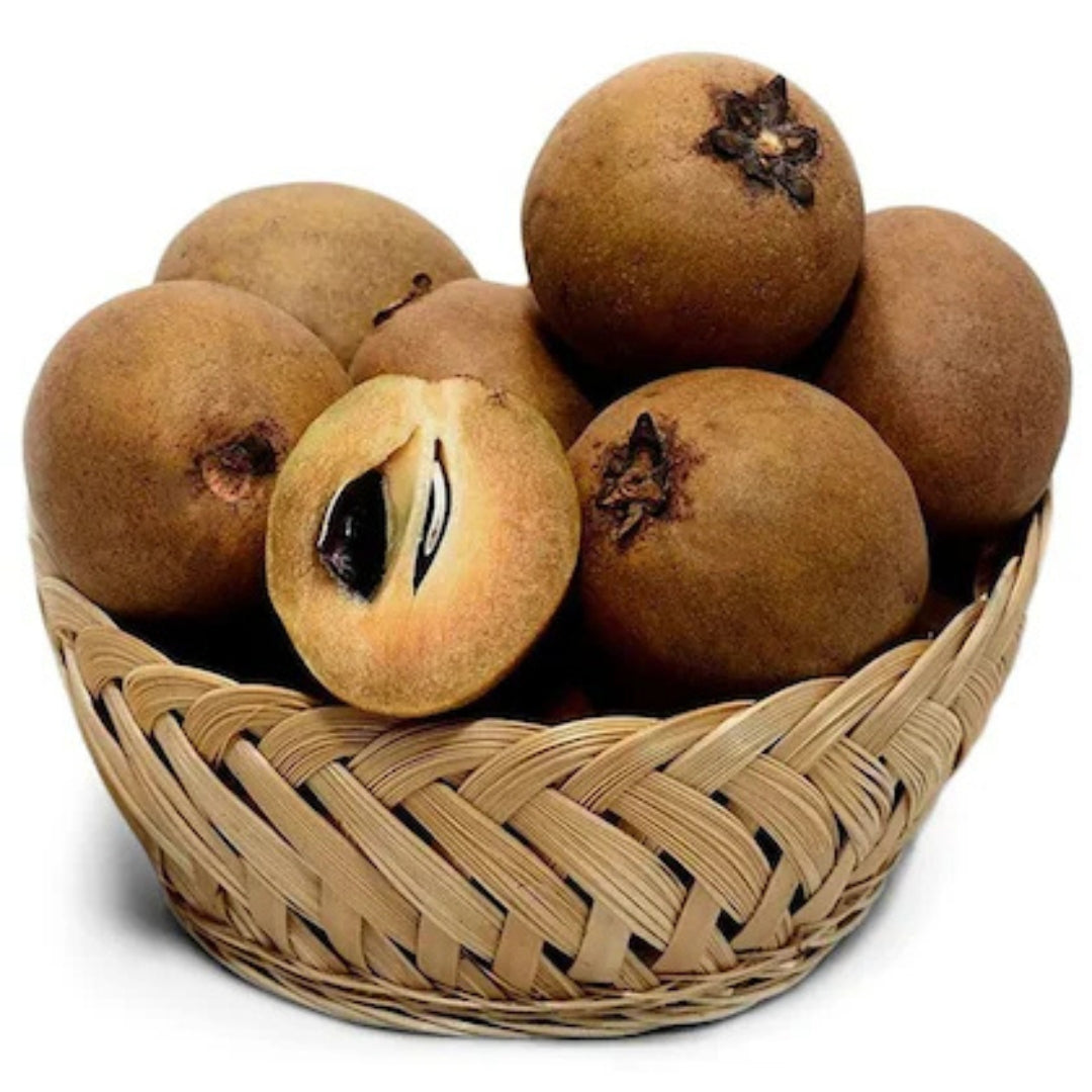 Basket of organic sapota online featuring whole and sliced ripe fruit with brown skin