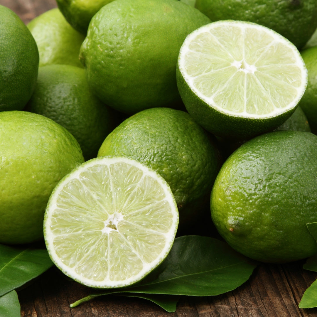 Fresh organic sweet lime displayed with vibrant green color and sliced halves showcasing juicy interior