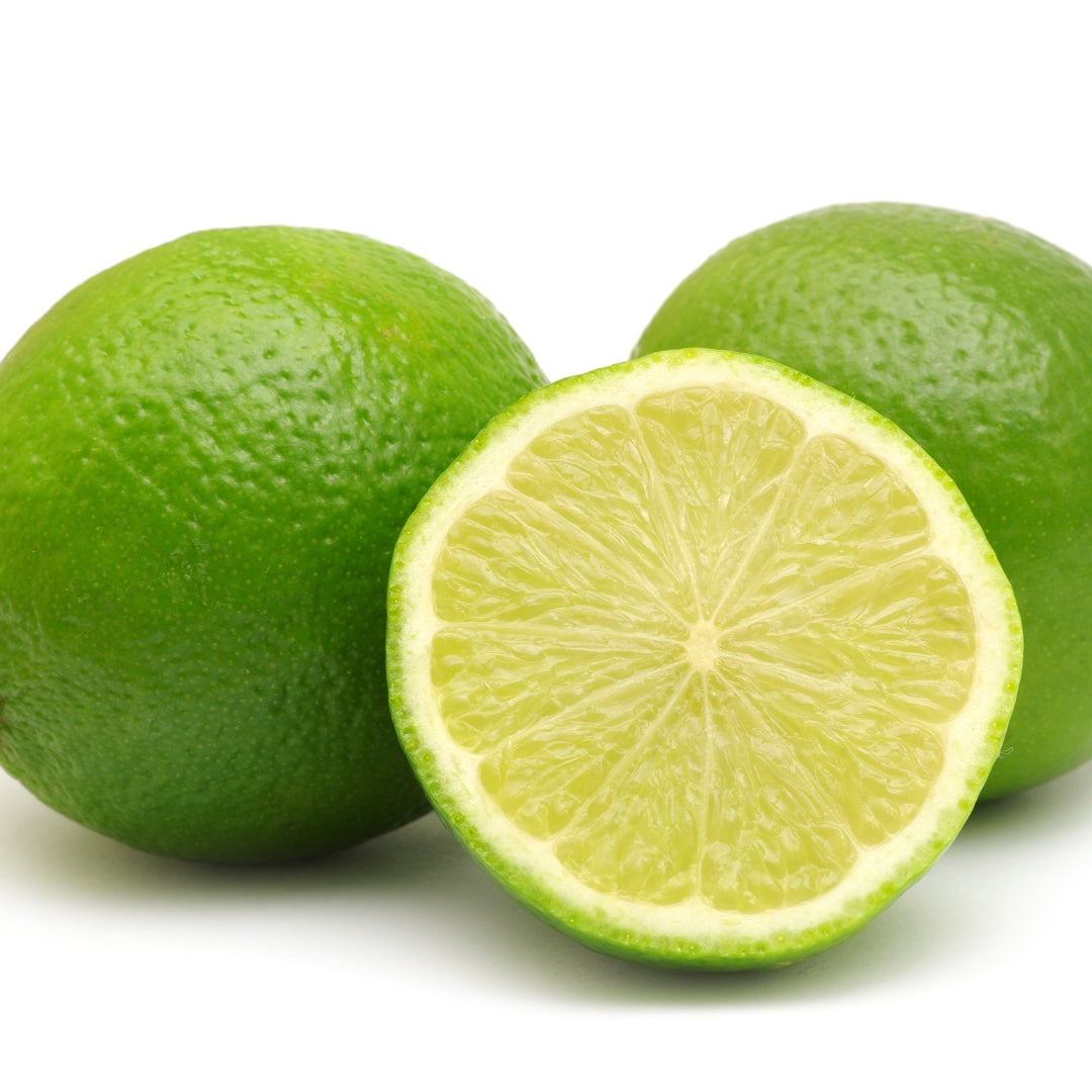 Fresh organic sweet lime with one lime cut in half showing juicy fruit inside