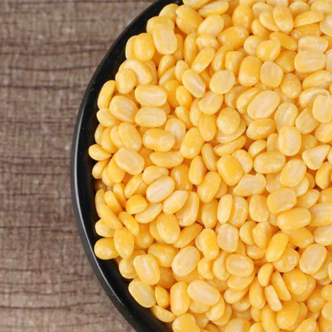 Bowl of organic yellow moong dal beans, ideal for healthy vegetarian dishes and protein-rich meals